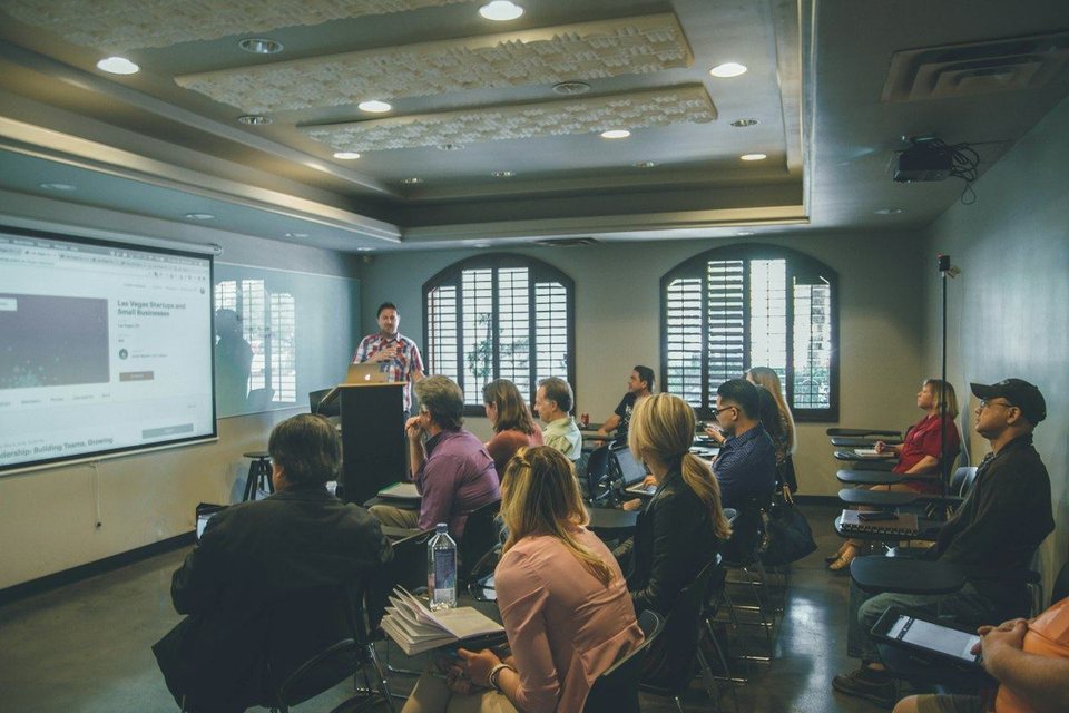 Adult students in a live real estate class