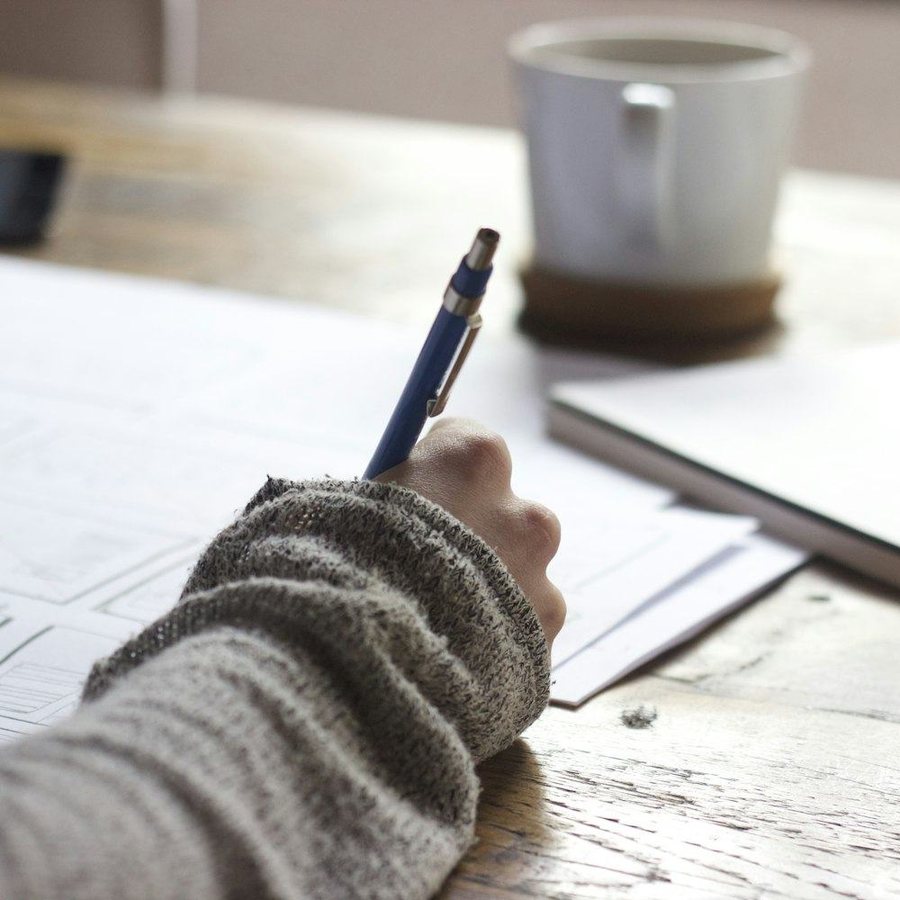 Student taking notes while studying for the Tennessee real estate exam